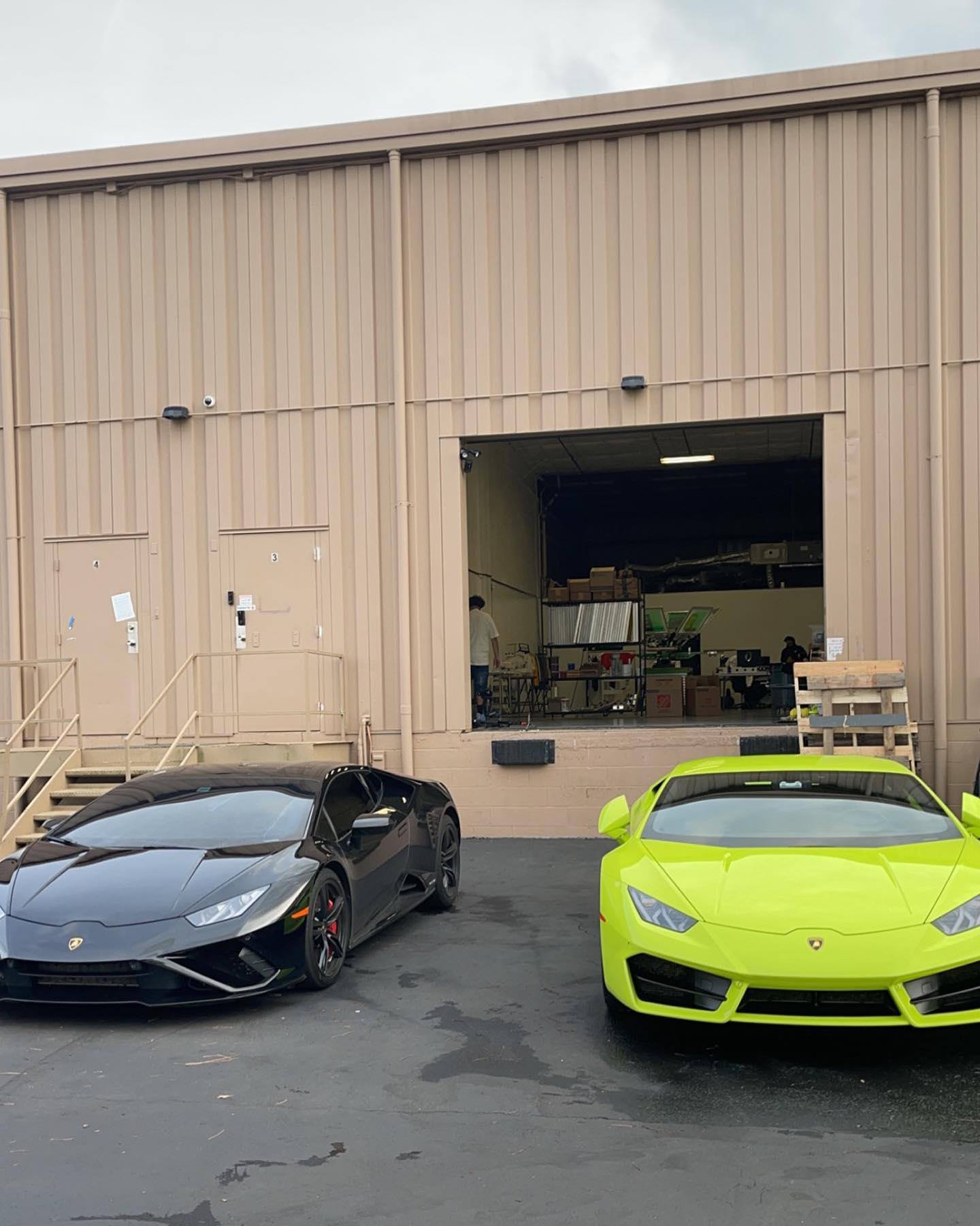 RICE LABS production facility exterior with open bay door
